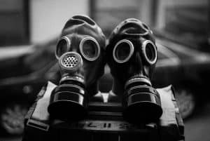 Two black gas masks side by side.